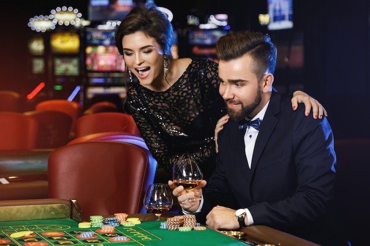 Live Caribbean Stud Poker table with professional dealer on link bet365